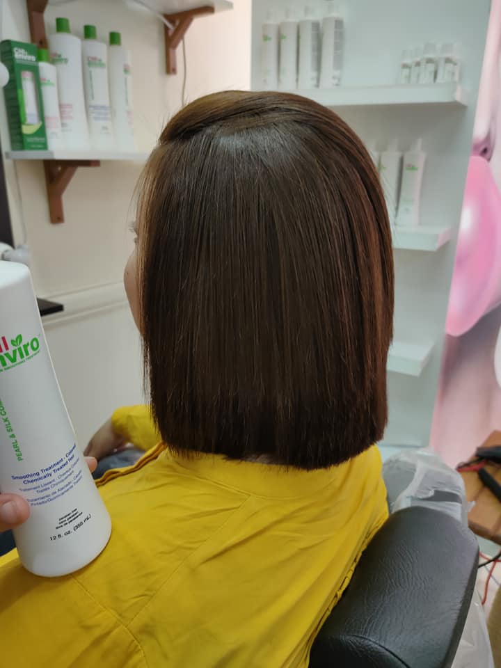 Short straight brown hair styling at Sanaa Ahmed beauty salon Short straight brown hair styling with smooth finish at Sanaa Ahmed beauty salon in New Cairo that serves clients in Fifth Settlement near Cairo Festival City and 5A Waterway Nasr City