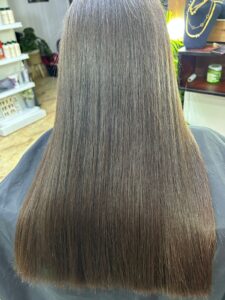 After hair treatment at Sanaa Ahmed Beauty Salon in New Cairo showing smooth, straight, shiny hair after professional smoothing service at a hair salon in New Cairo
