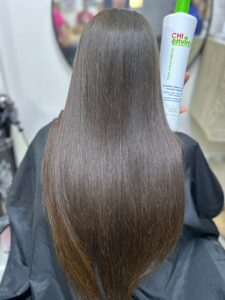 After CHI Enviro smoothing treatment at Sanaa Ahmed Beauty Salon in New Cairo showing long, smooth, glossy hair after a professional beauty salon service in New Cairo