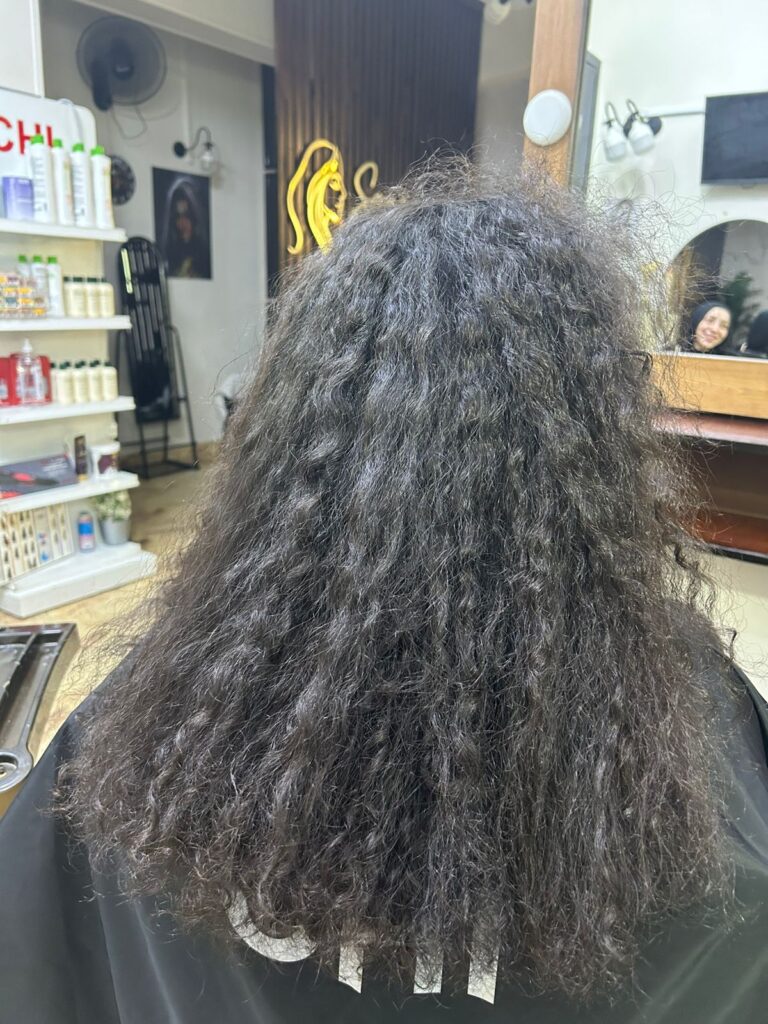 IMG-20260419-WA0017 Before CHI Enviro hair smoothing result at women’s Hair Salon New Cairo