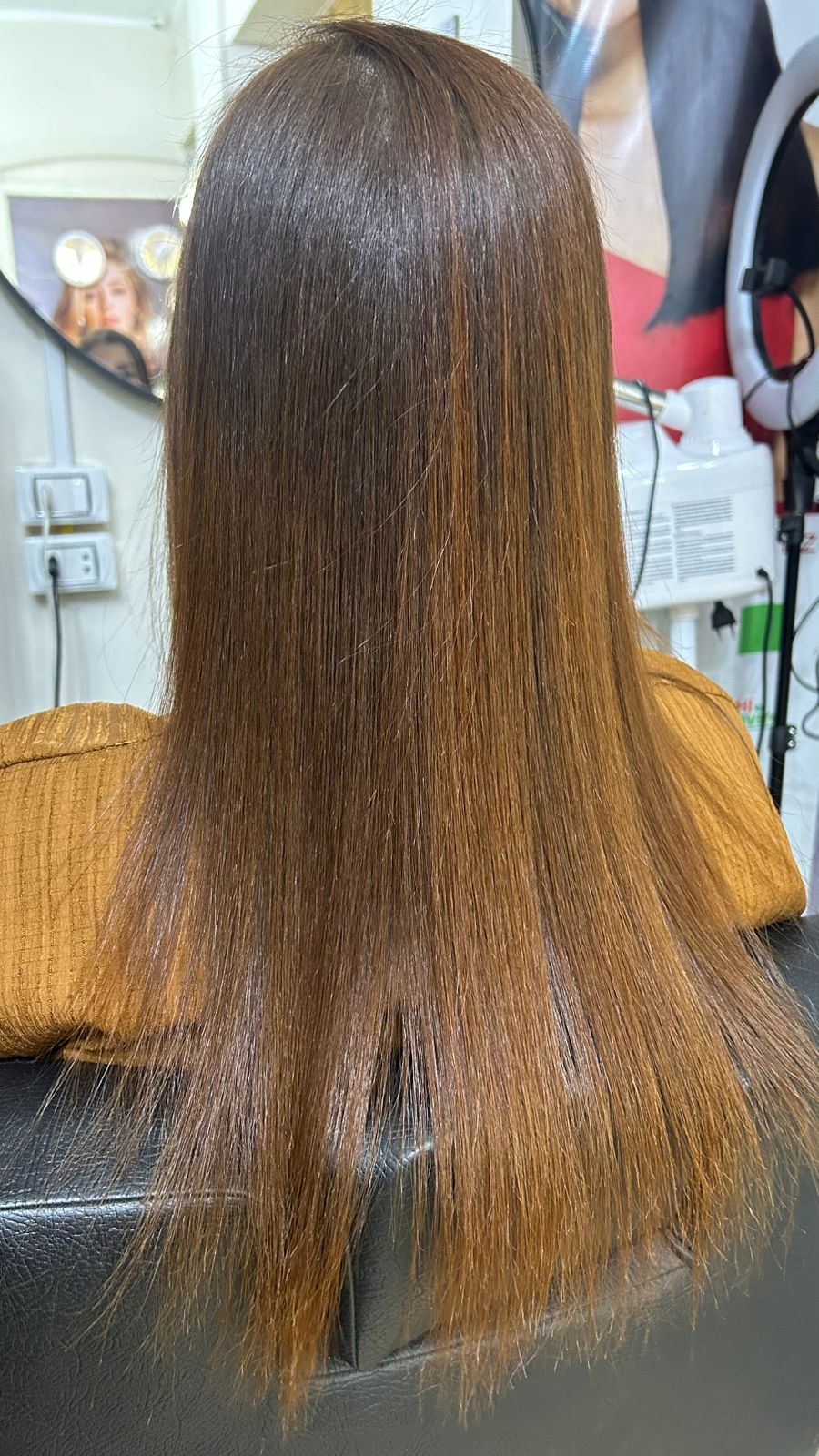 Brown hair transformation after CHI treatment at Sanaa Ahmed Beauty Salon, New Cairo