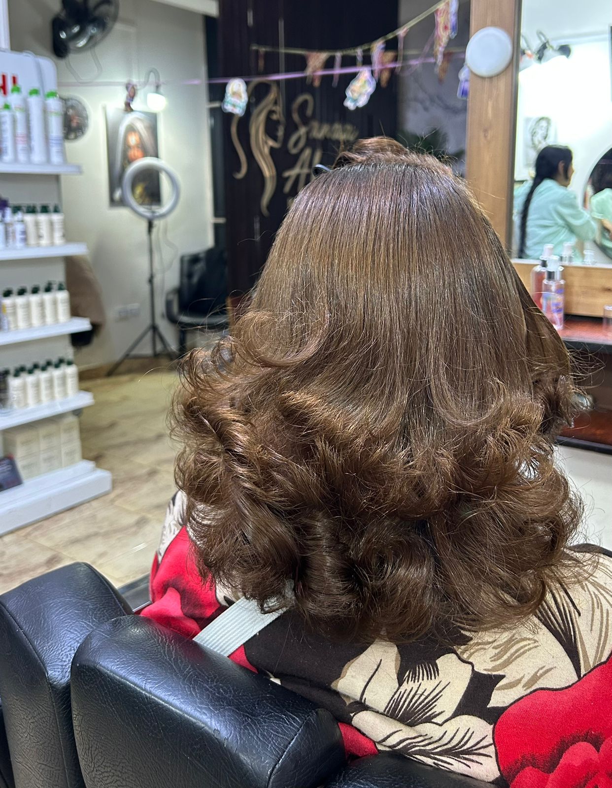 Warm brown curls hair result near Mountain View 1 New Cairo Sanaa Ahmed Beauty Salon